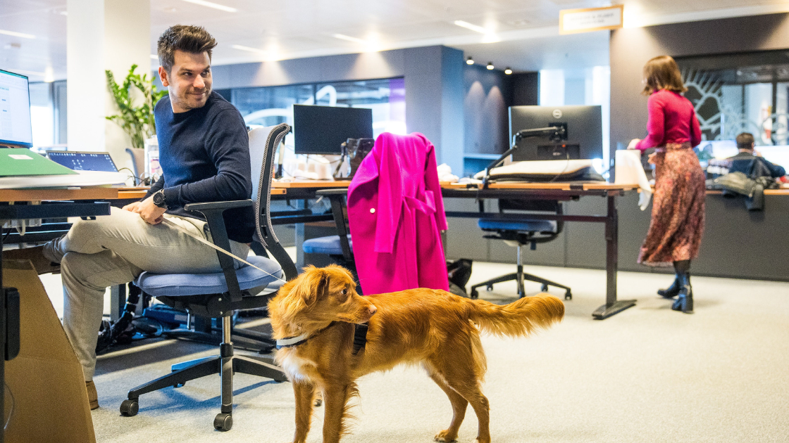 Stefan Klockaerts at the Mars office in Belgium, with his colleague’s dog GusGus