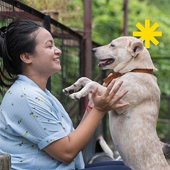 Woman holding her dog