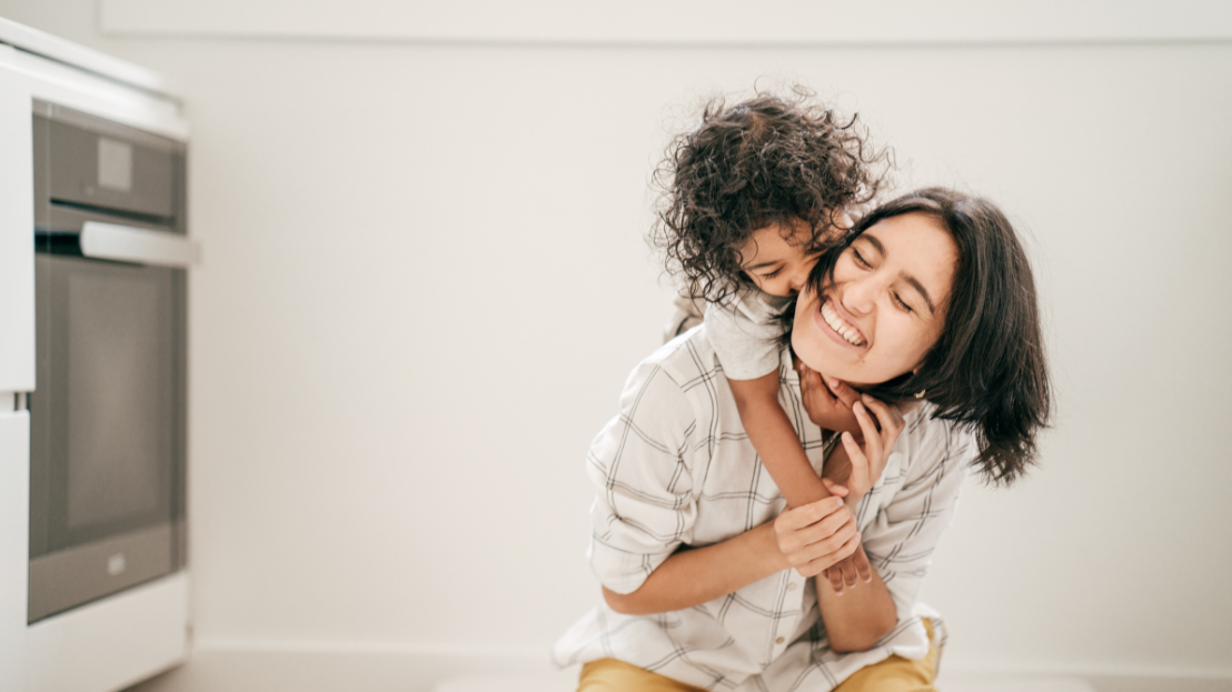 Woman and child hugging 