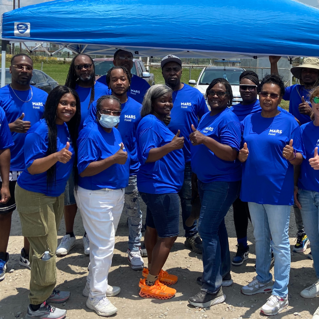 Mars volunteers pose for a photo at a mobile pantry