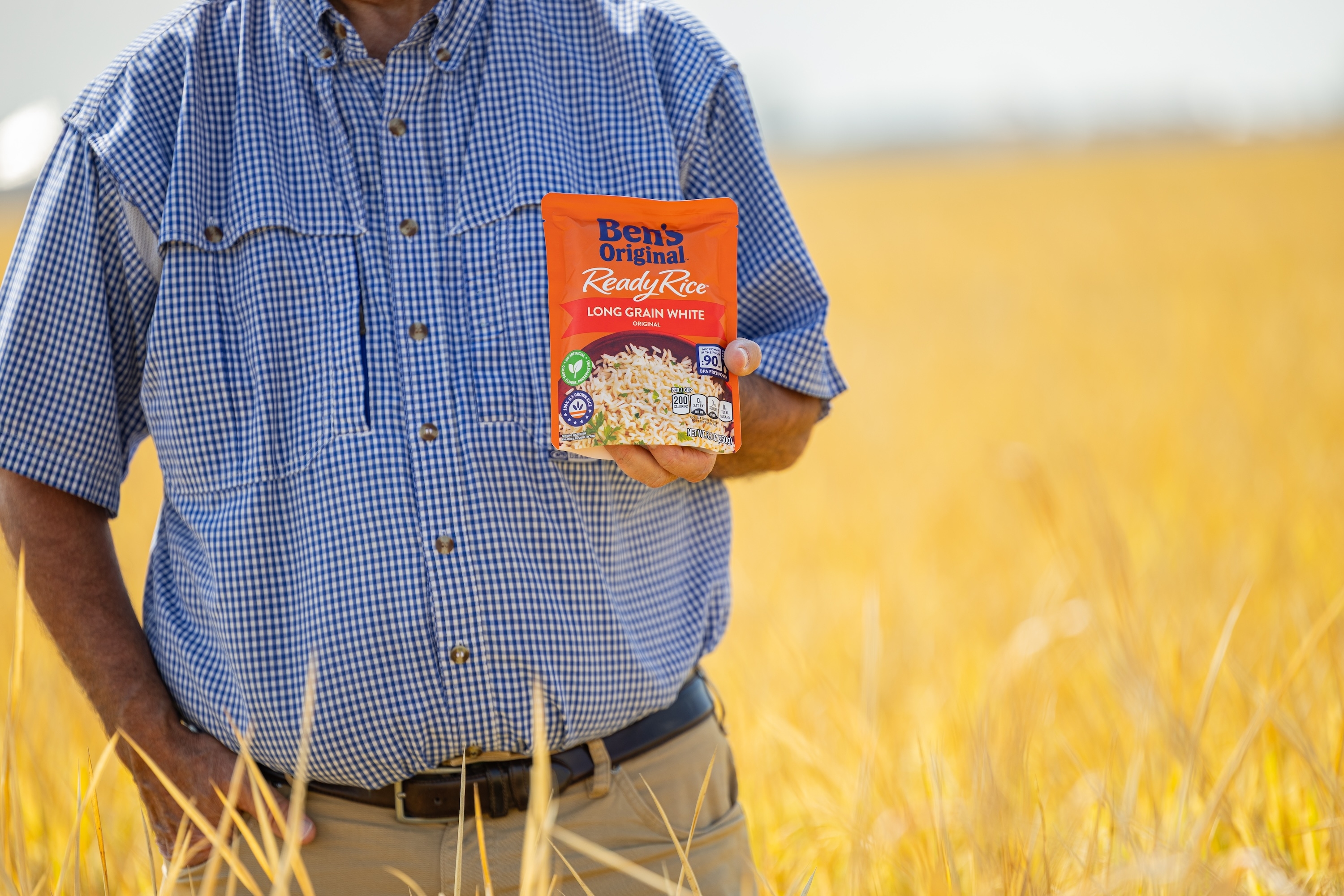 Farmer holding Ben's Original product
