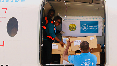 Employees of the World Food Programme, partner of Mars, Incorporated, delivering supplies.