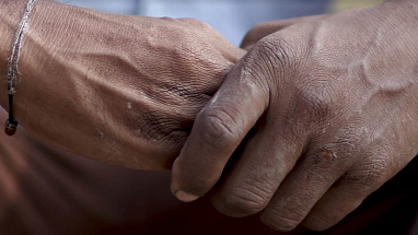 Two people holding hands