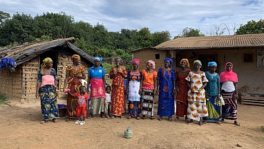 A group of women gathered in a Côte d’Ivoire village.
