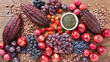 Cacao pods with various fruits on a table