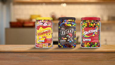 Recycled Starburst, M&M's and Skittles bulk packaging on a kitchen counter