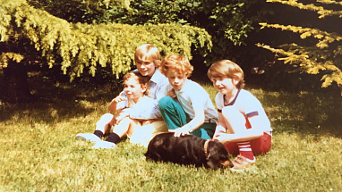 Loic Moutault as a young boy with his first dog, Pupuce