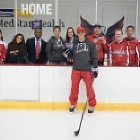 NHL player TJ Oshie poses with the Mars™ team