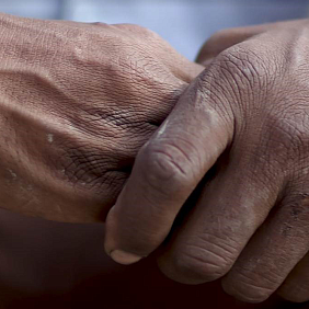 Two people holding hands