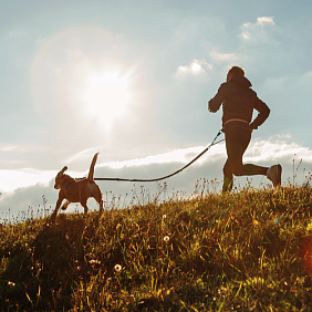 Man running with his dog.