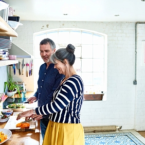 A couple cooks a nutritious meal