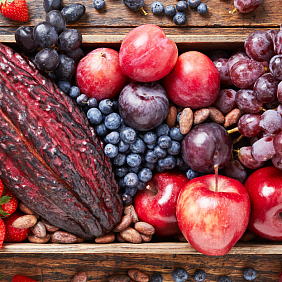 Cacao pods with various fruits on a table