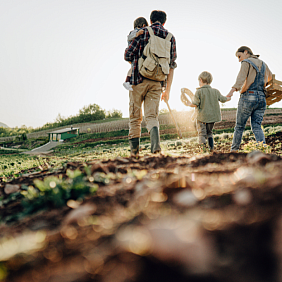 A family walking outside in a field