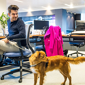 Stefan Klockaerts at the Mars office in Belgium, with his colleague’s dog GusGus