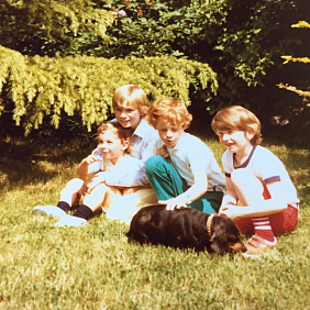 Loic Moutault as a young boy with his first dog, Pupuce