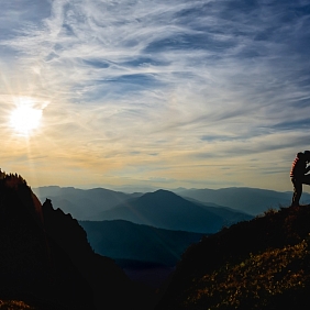 Person with a dog on a mountain